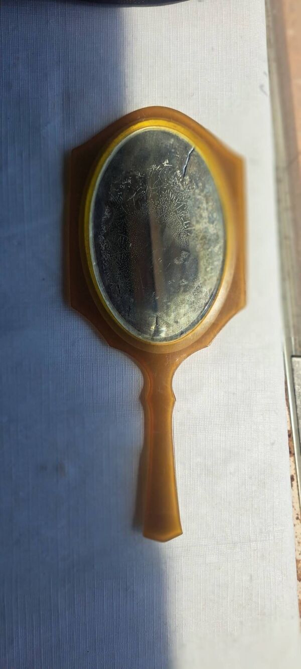 Vintage early plastic/celluloid-style vanity mirror, likely dating from the earl